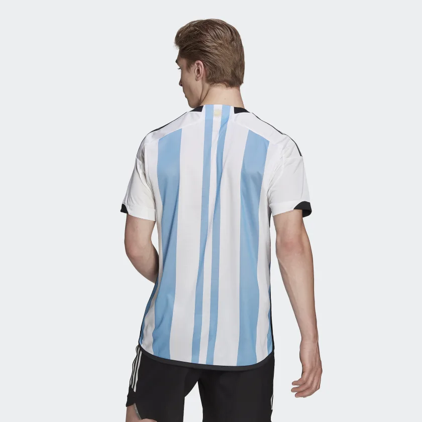 wearing Argentina official soccer jersey back wearing Argentina official soccer jersey back